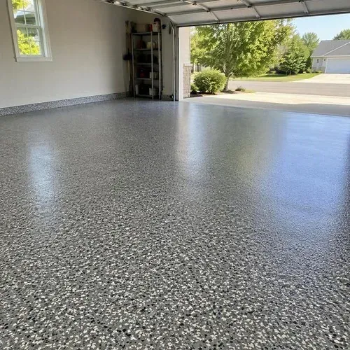 Finished speckled flake-coated garage floor after concrete polishing and coating