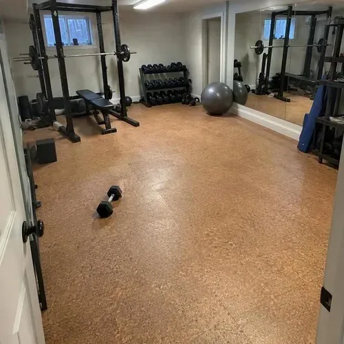 Finished cork tile floor in home gym after cork floor installation