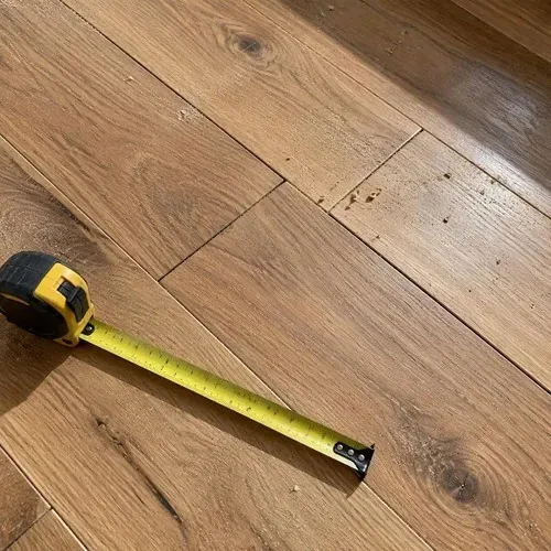 Staggered end joints on new engineered planks after engineered hardwood installation