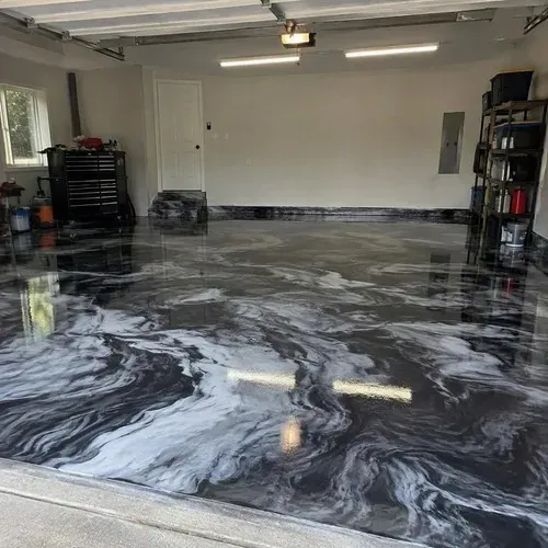 Black and white marble-look epoxy garage floor after epoxy floor installation