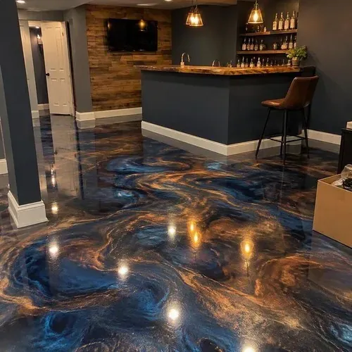 Finished metallic swirl epoxy floor in basement bar after epoxy floor installation