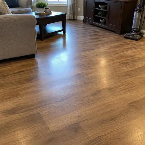 Replaced laminate planks blended into old floor during floor and subfloor repair