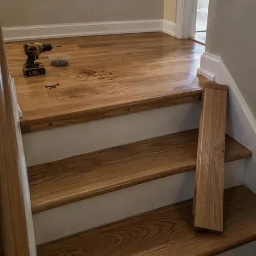 Hardwood around stair landing nosing, partly done during hardwood floor installation