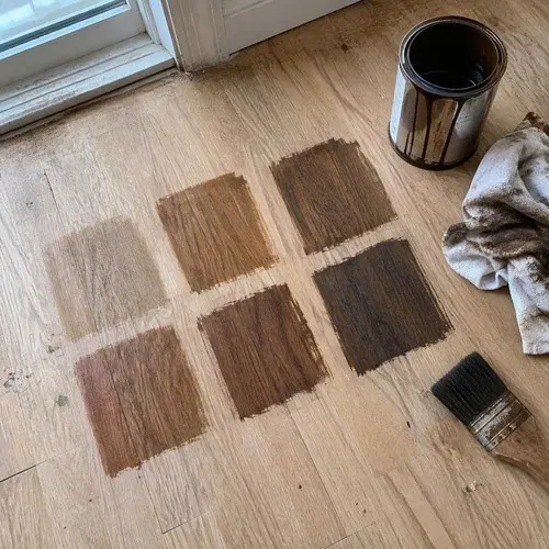 Stain sample squares on bare sanded oak during hardwood floor sanding and refinishing