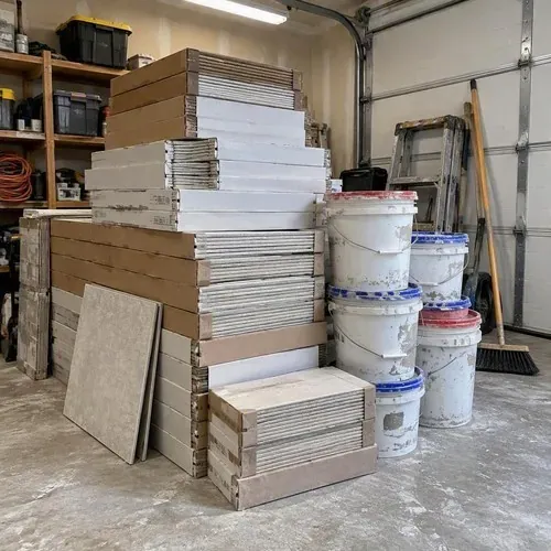 Tile boxes and thinset buckets stacked in garage during ceramic and porcelain tile installation