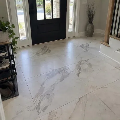 Finished marble-look porcelain tiles in entryway after ceramic and porcelain tile installation