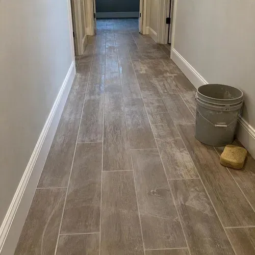 New wood-look porcelain tile with grout haze during ceramic and porcelain tile installation